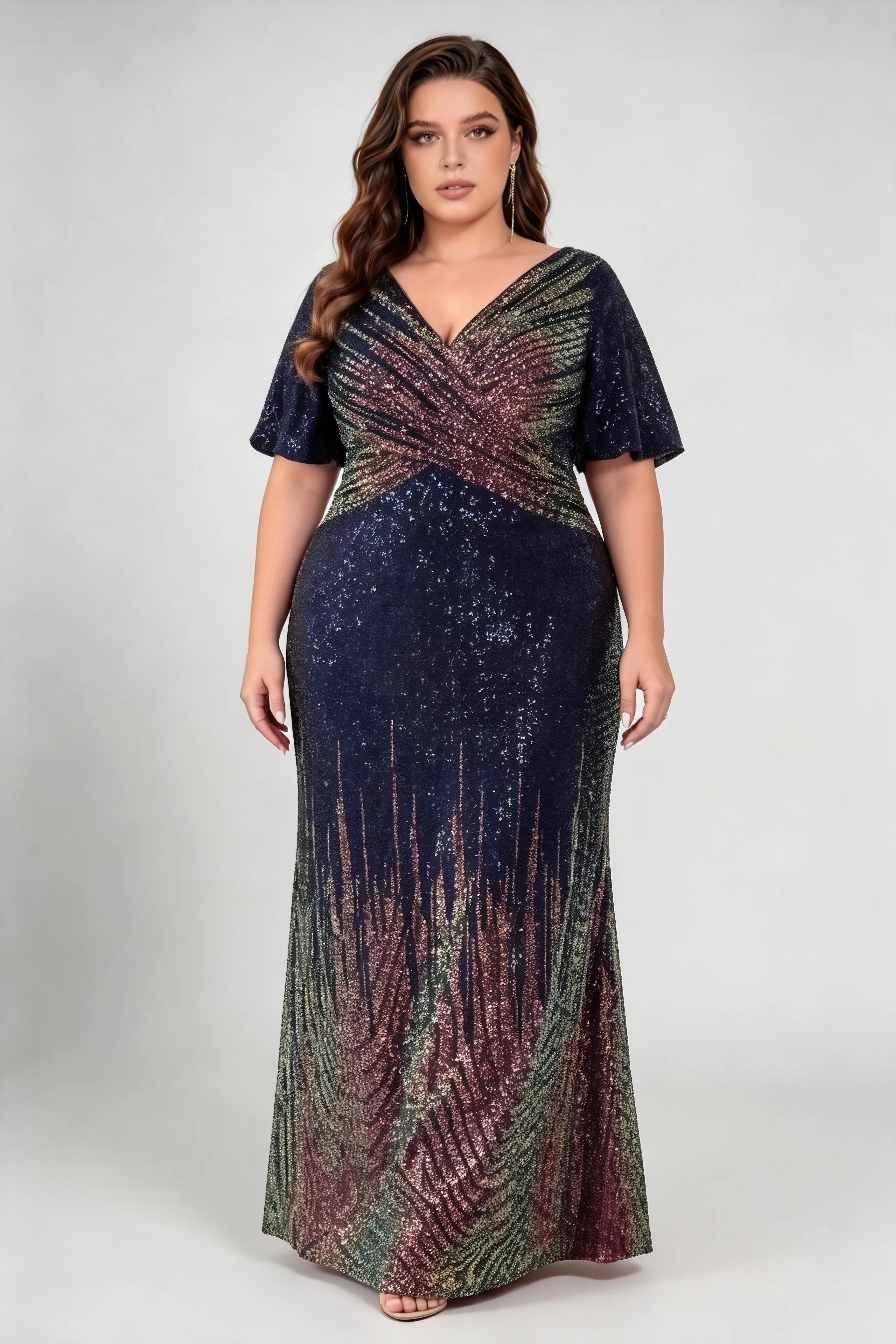 Curvy model wearing plus size navy ombre multicolor sequin wrap v neck flutter short sleeve mermaid maxi formal evening gown