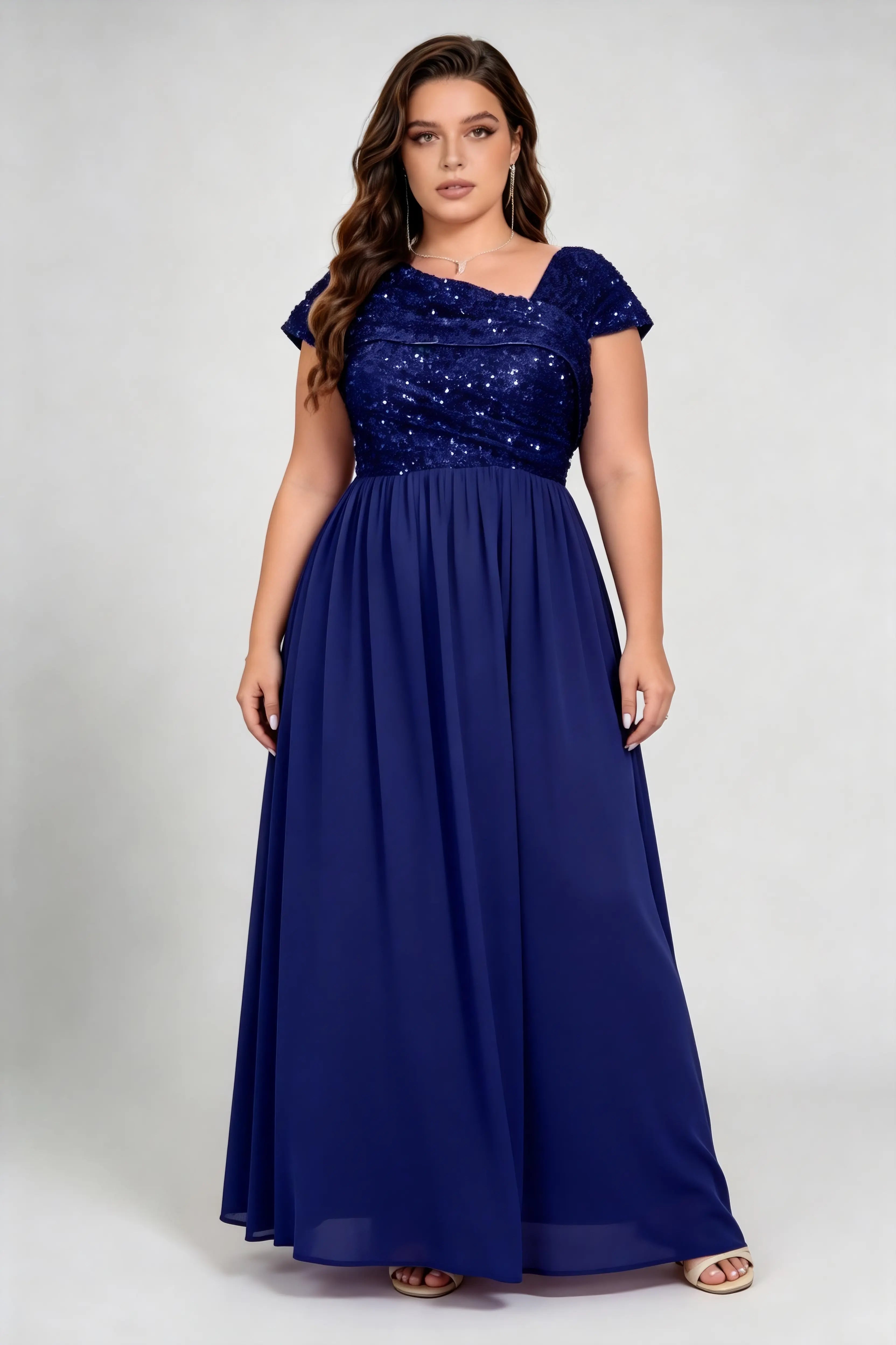 Curvy model wearing plus size blue asymmetric neck sequin bodice chiffon a line maxi bridesmaid formal evening dress