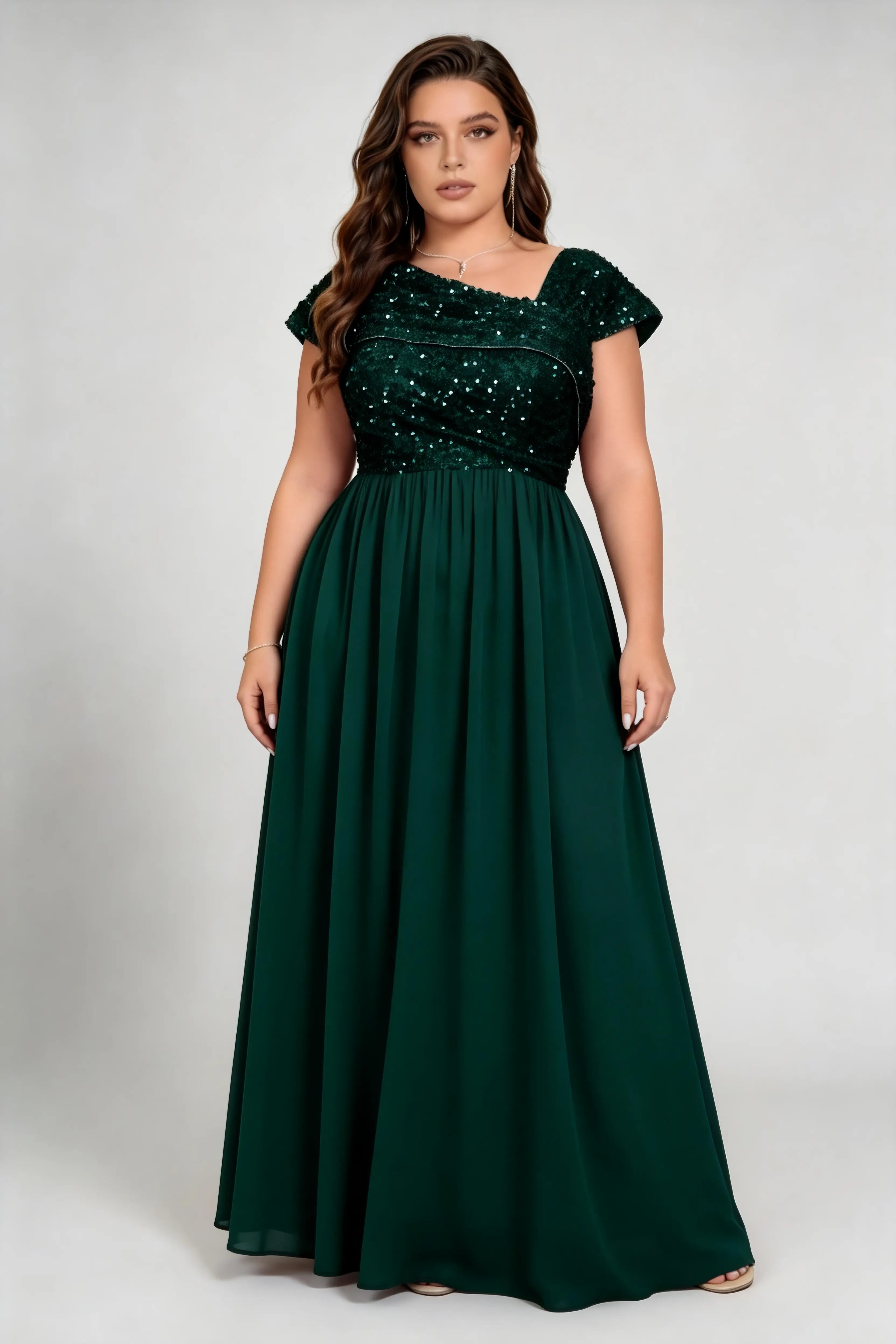 Curvy model wearing plus size green asymmetric neck sequin bodice chiffon a line maxi bridesmaid formal evening dress