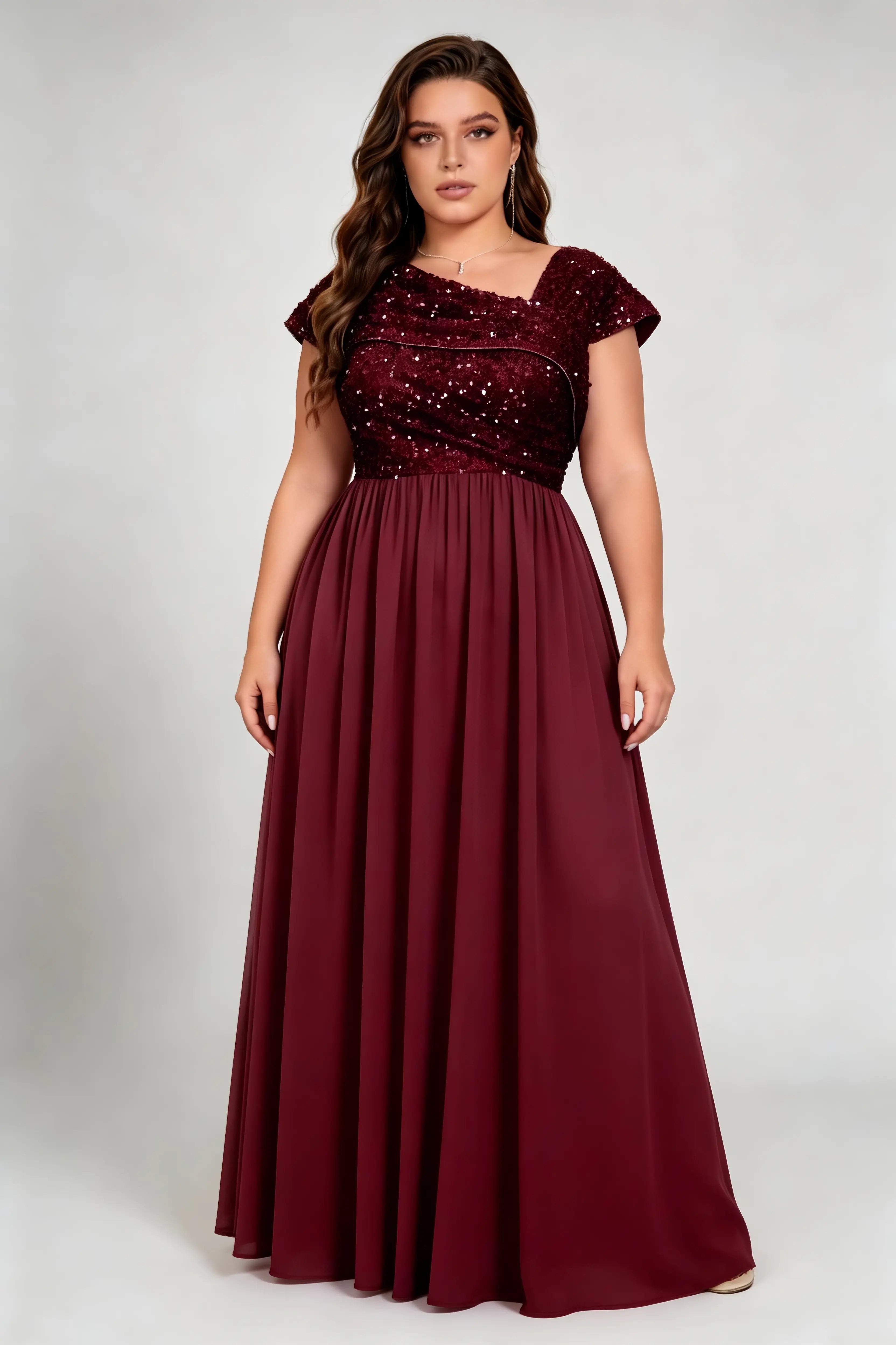 Curvy model wearing plus size burgundy asymmetric neck sequin bodice chiffon a line maxi bridesmaid formal evening dress