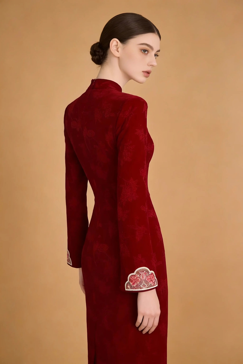 Woman wearing a Red Floral Embroidered Qipao Dress on a brown background