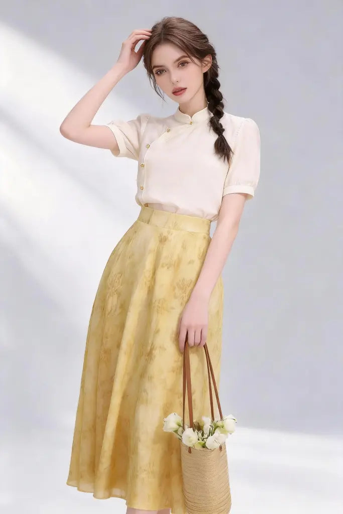 Woman wearing Beige Stand-Collar Blouse + Yellow Floral Midi Skirt, Elegant Spring Summer Two-Piece Set on a plain background