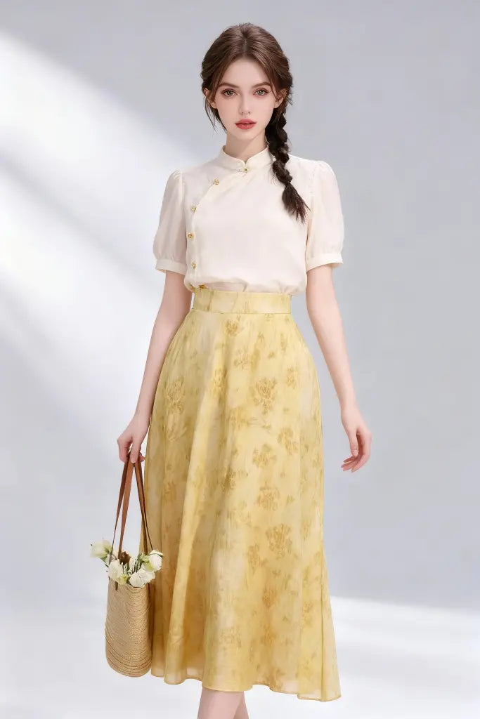 Woman wearing Beige Stand-Collar Blouse + Yellow Floral Midi Skirt, Elegant Spring Summer Two-Piece Set on a plain background