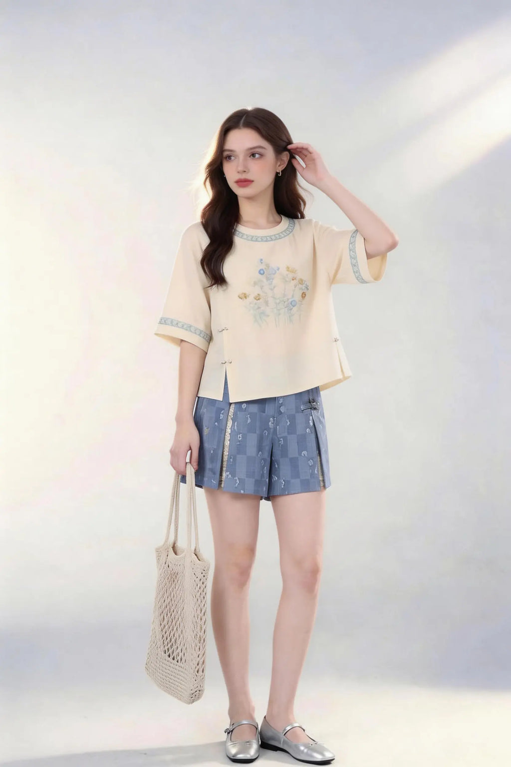 Woman wearing Vintage Floral Embroidered Top & Tie-Dye Shorts Two-Piece Set with a white background