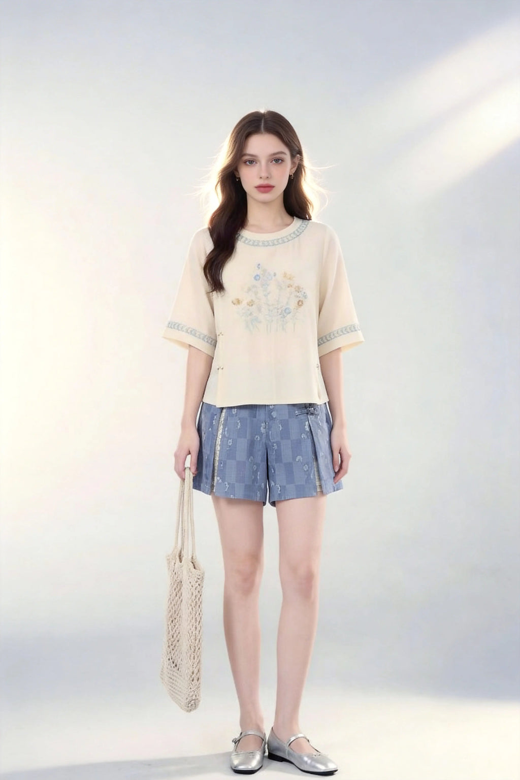 Woman wearing Vintage Floral Embroidered Top & Tie-Dye Shorts Two-Piece Set with a white background