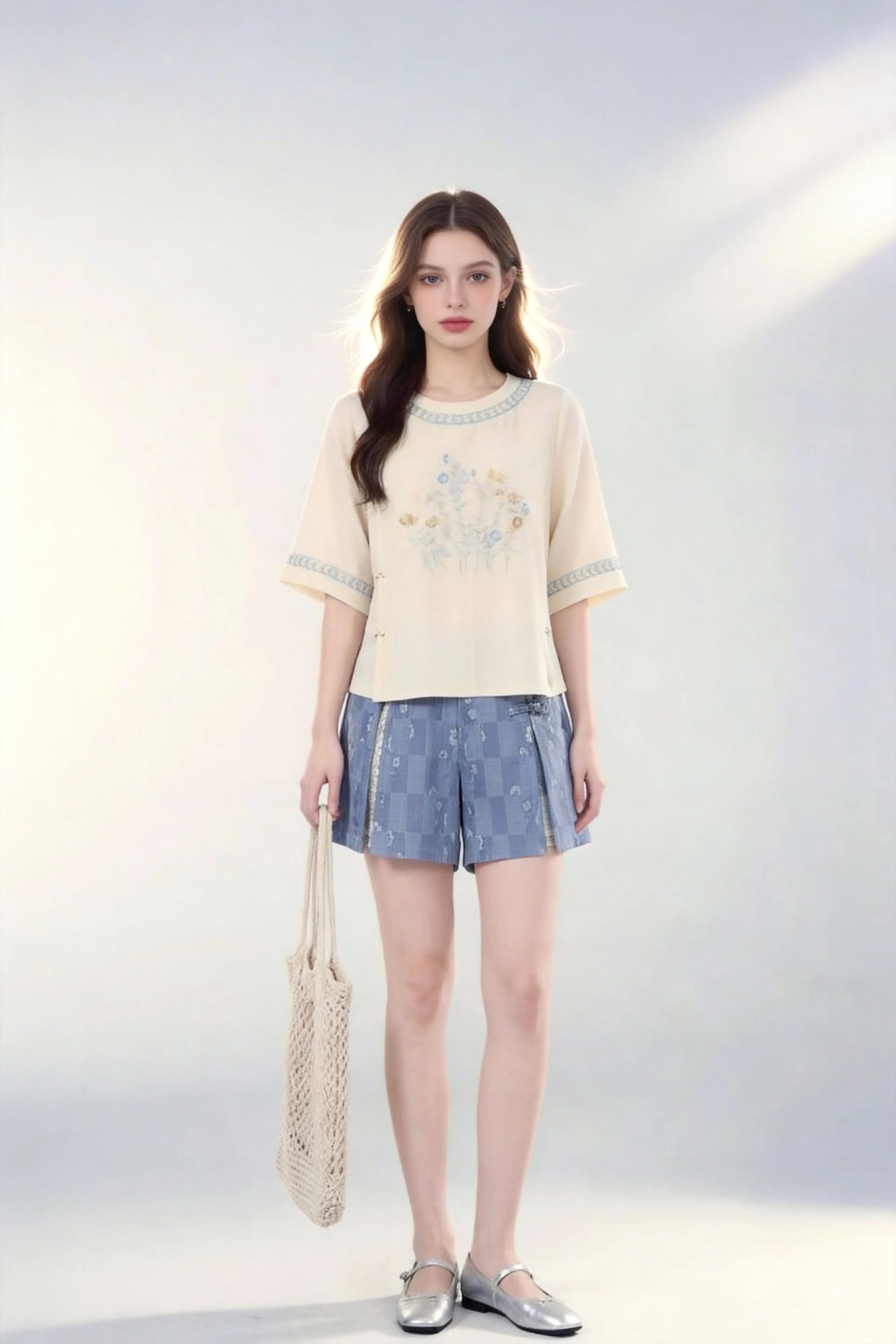 Woman wearing Vintage Floral Embroidered Top & Tie-Dye Shorts Two-Piece Set with a white background