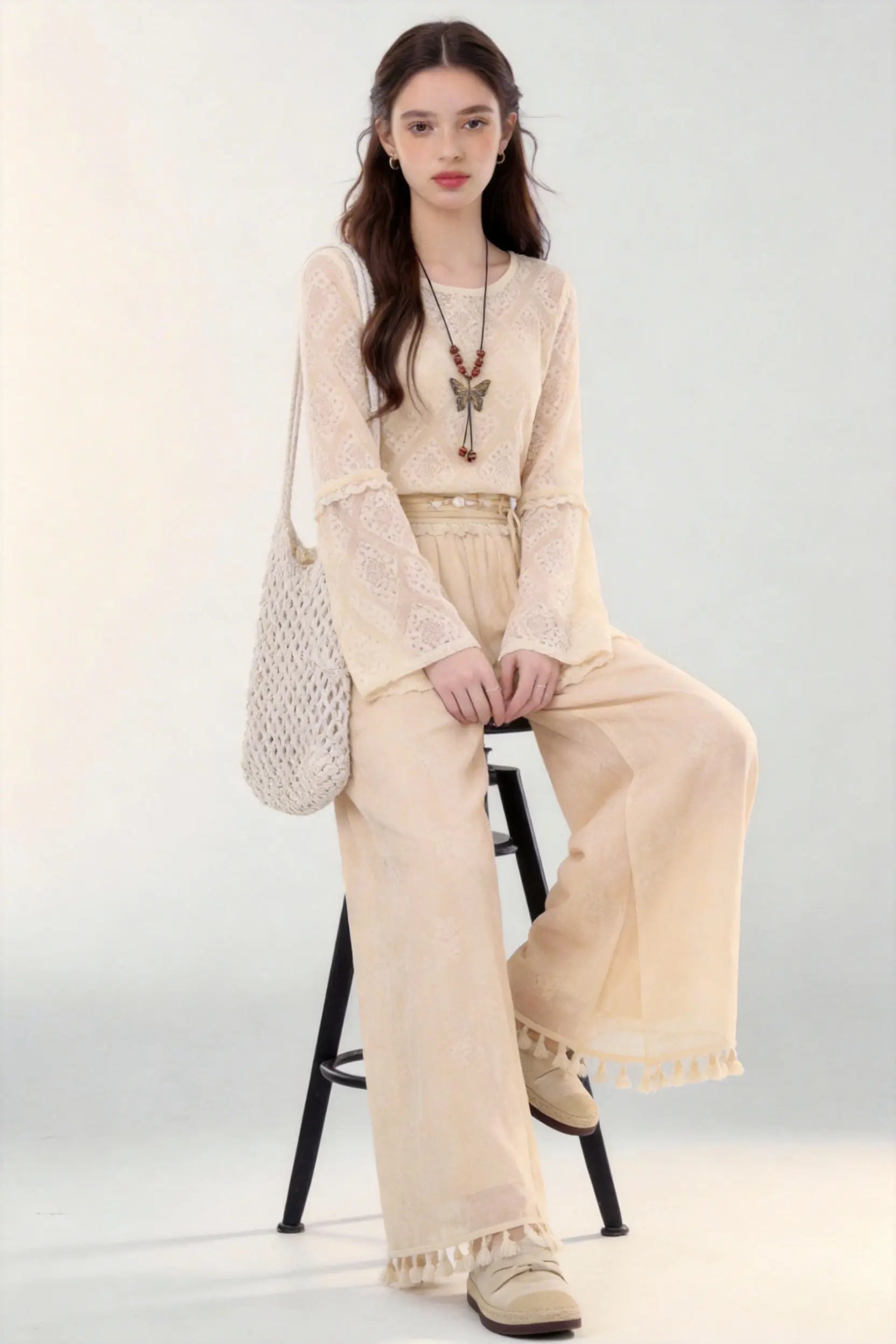 Woman in a beige Spring Summer New Ancient Style Hollow Lace Top High Waist Straight Wide Leg Pants Daily Versatile Two-Piece Set  against a white background