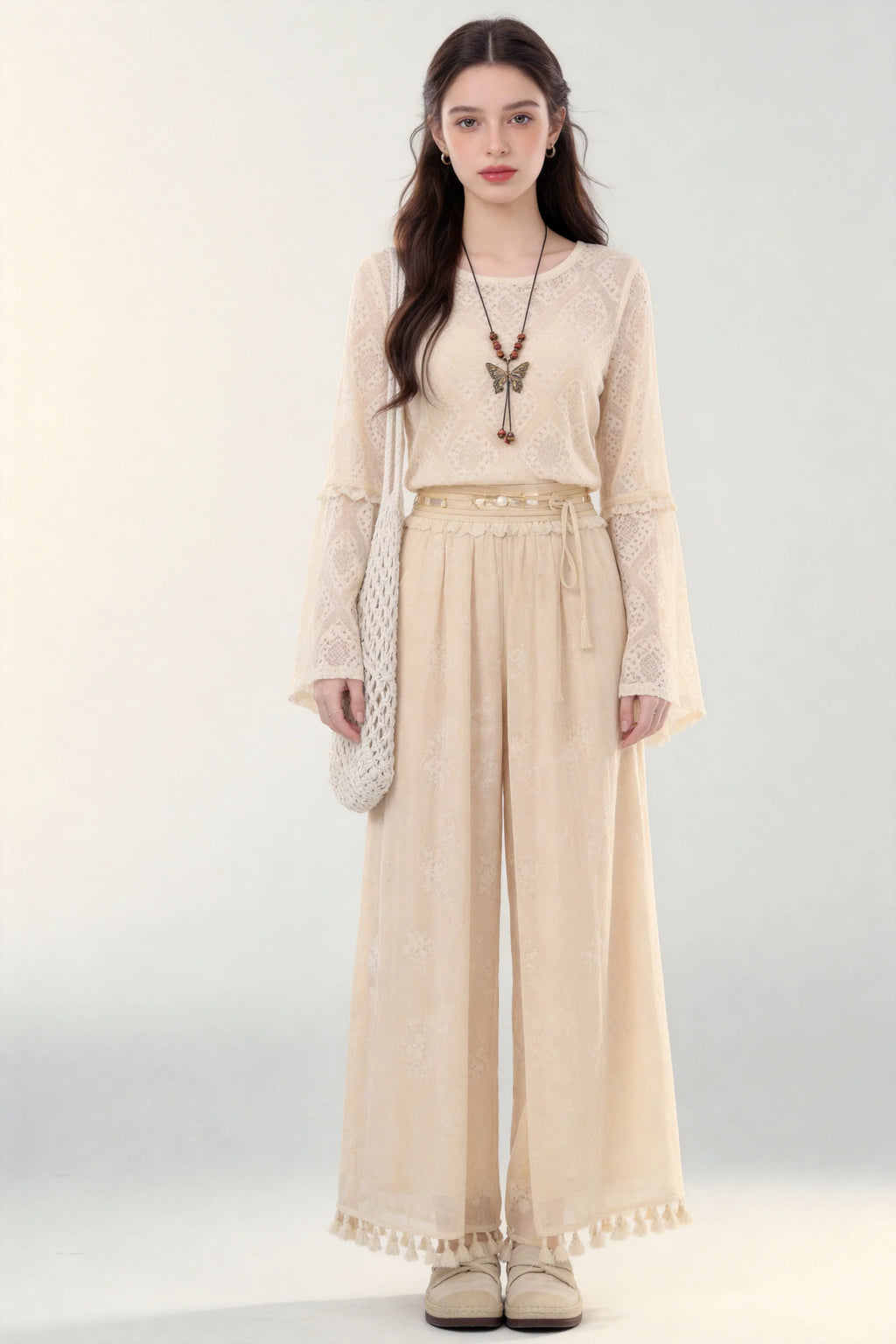 Woman in a beige Spring Summer New Ancient Style Hollow Lace Top High Waist Straight Wide Leg Pants Daily Versatile Two-Piece Set  against a white background
