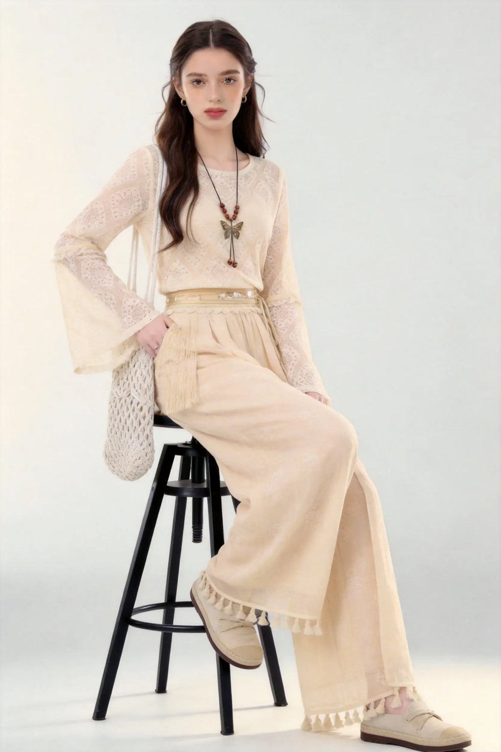 Woman in a beige Spring Summer New Ancient Style Hollow Lace Top High Waist Straight Wide Leg Pants Daily Versatile Two-Piece Set  against a white background