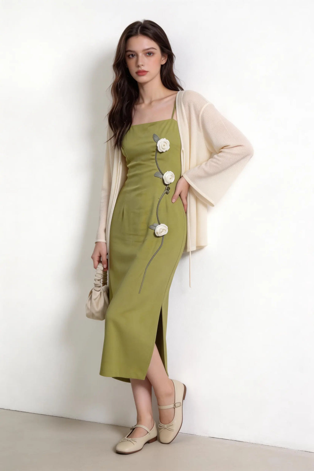 Woman wearing a Sage Green Rose Appliqu¨¦ Slip Dress with Sheer Cream Cardigan against a white background