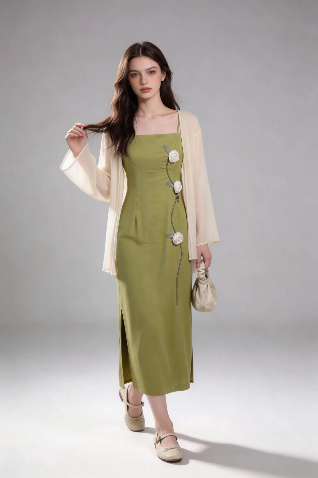 Woman wearing a Sage Green Rose Appliqu¨¦ Slip Dress with Sheer Cream Cardigan against a white background
