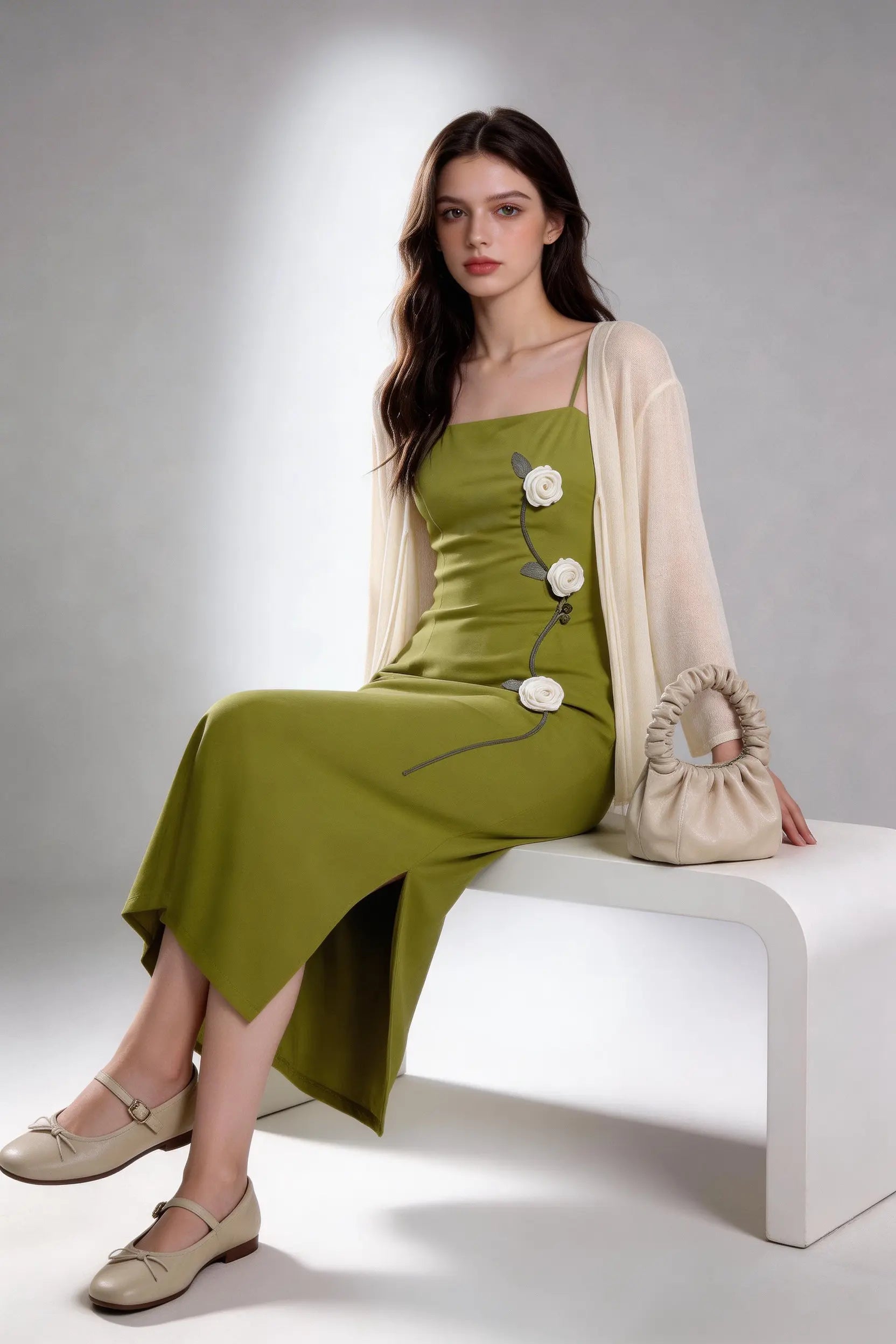 Woman wearing a Sage Green Rose Appliqu¨¦ Slip Dress with Sheer Cream Cardigan against a white background