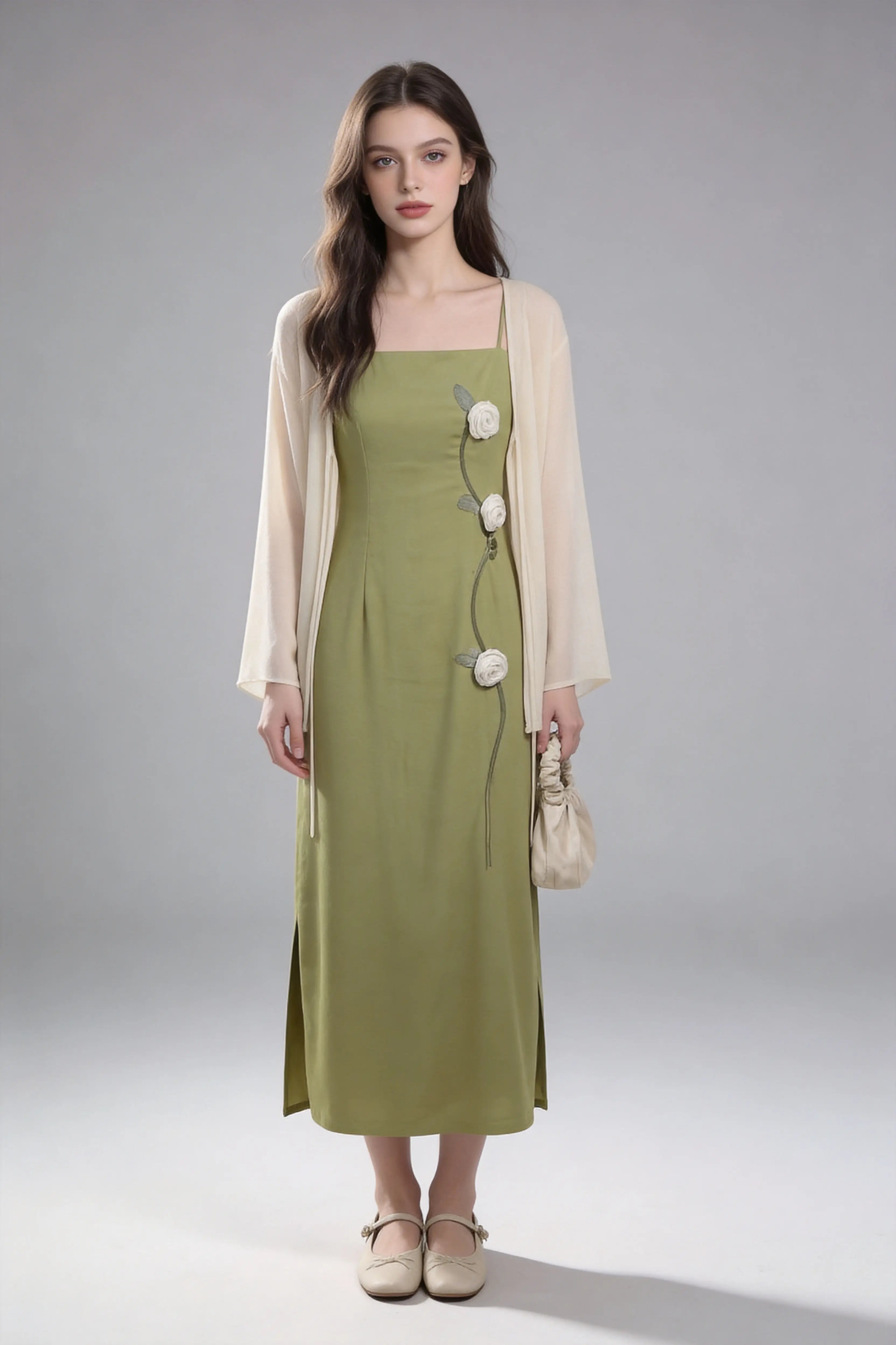Woman wearing a Sage Green Rose Appliqu¨¦ Slip Dress with Sheer Cream Cardigan against a white background