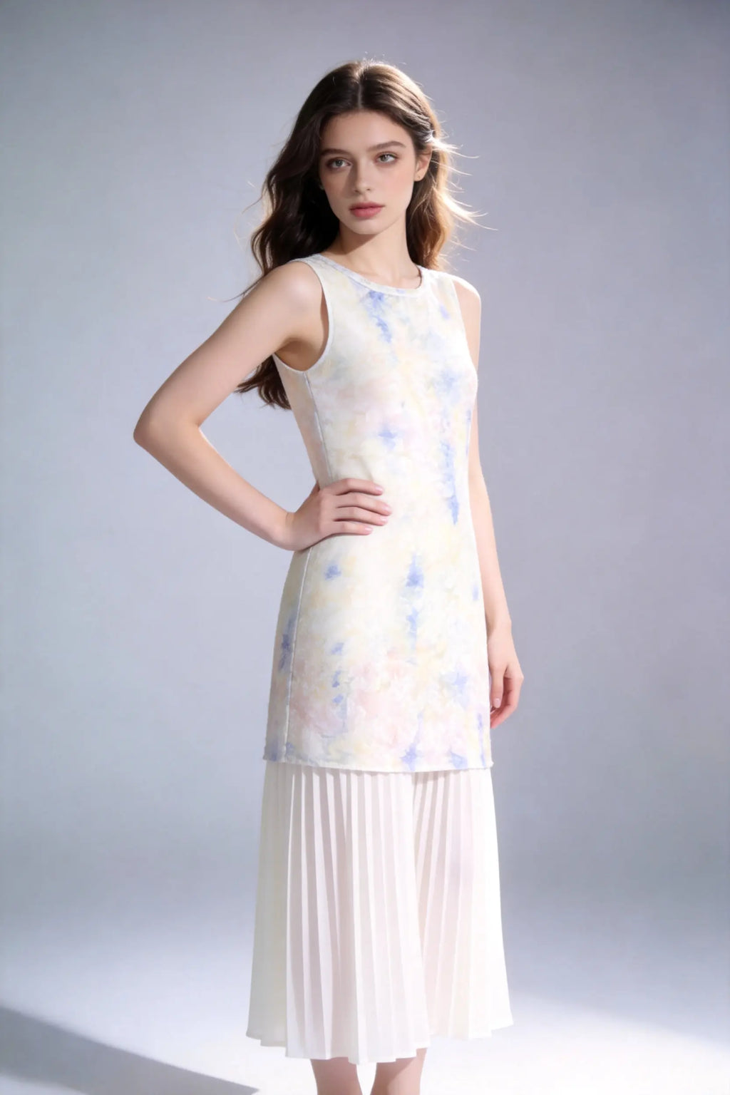Woman wearing a Watercolor Print Sleeveless Midi Dress with Pleated Hem on a plain background