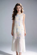 Woman wearing a Watercolor Print Sleeveless Midi Dress with Pleated Hem on a plain background