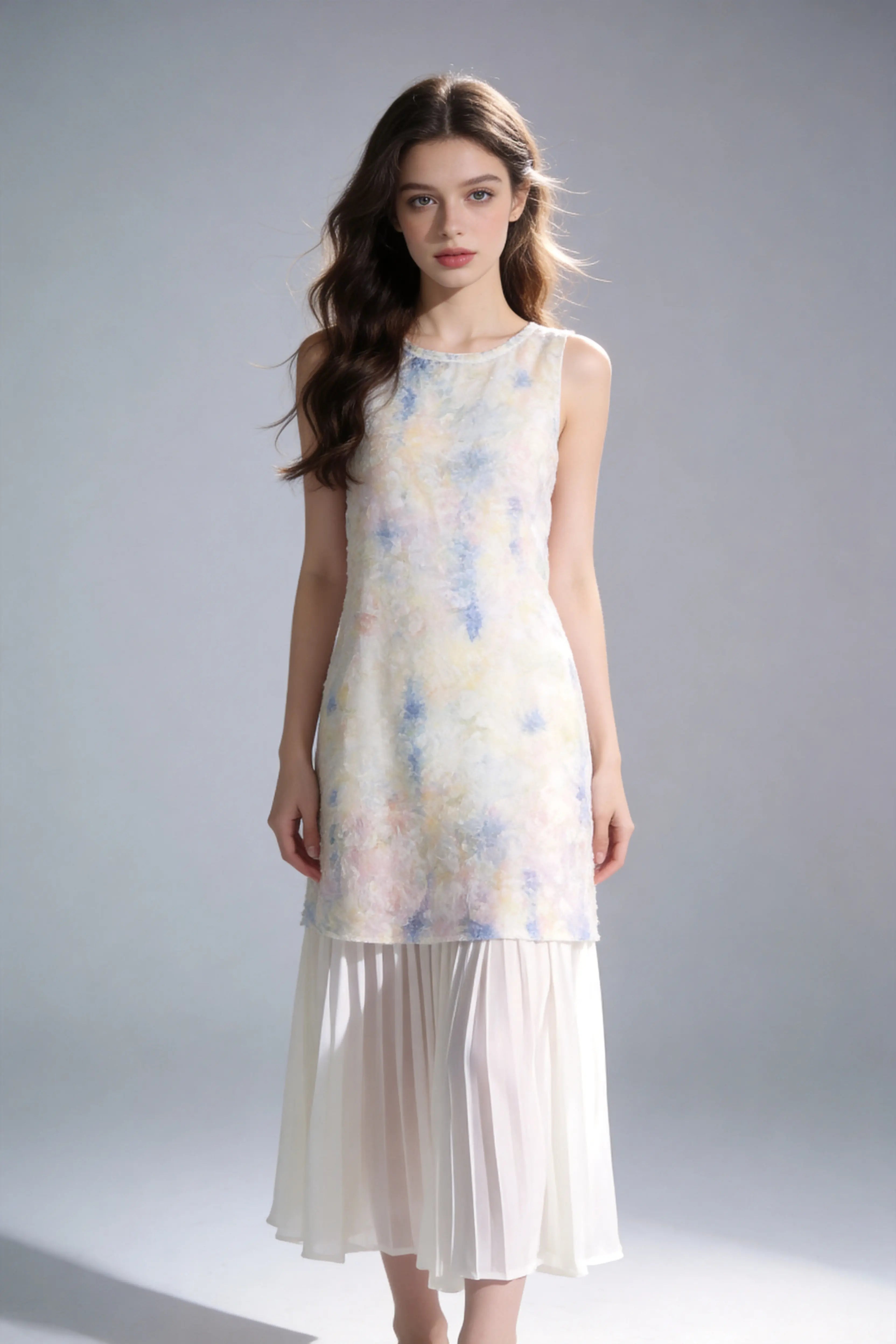 Woman wearing a Watercolor Print Sleeveless Midi Dress with Pleated Hem on a plain background