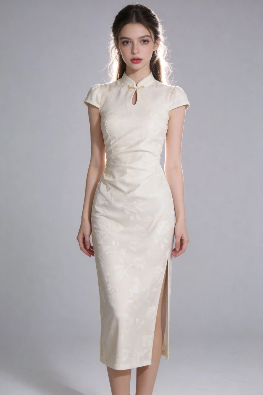 Woman wearing a vintage jacquard qipao dress - elegant mandarin collar cheongsam dress with a high slit on a plain background
