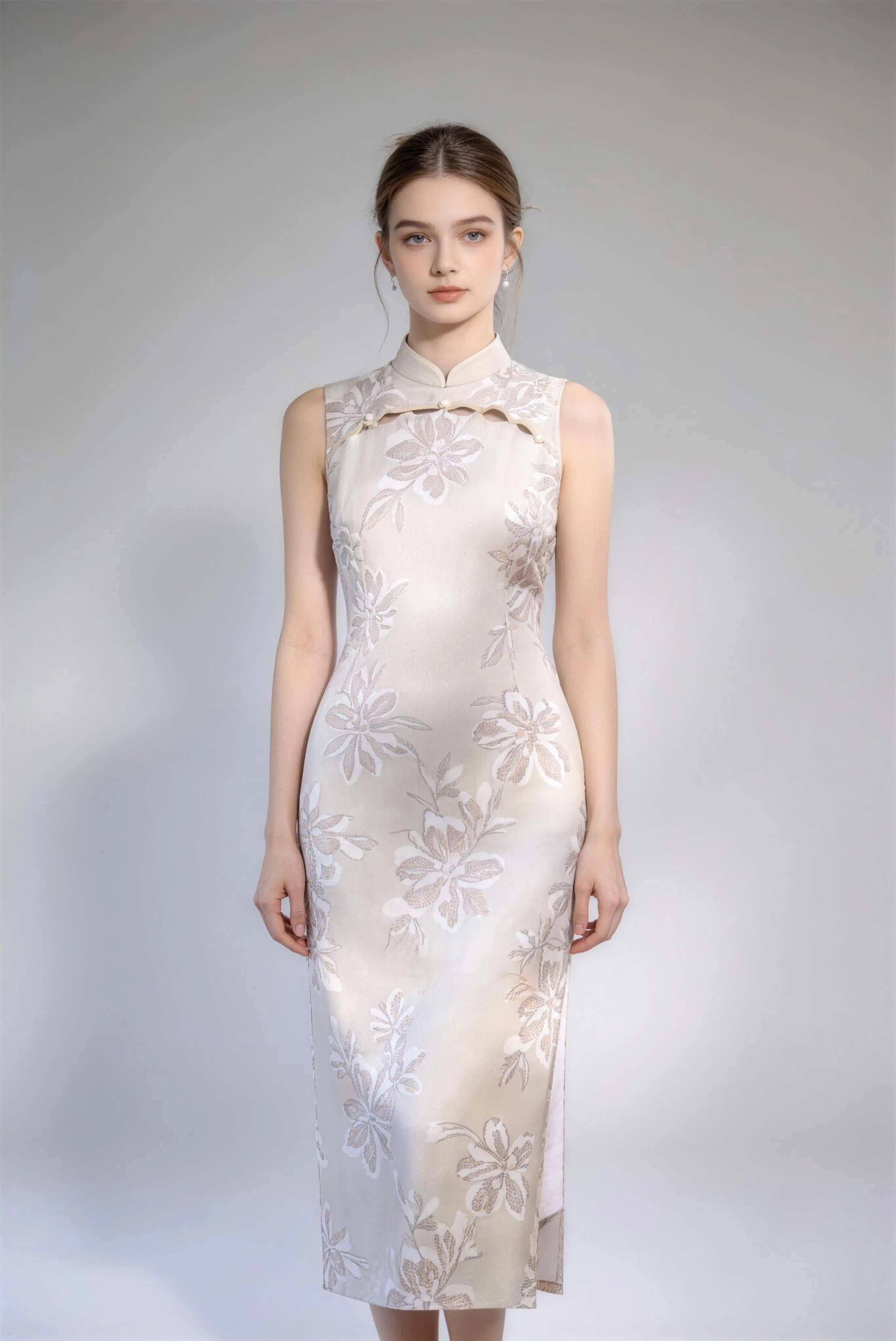 Woman wearing sleeveless floral embroidery cheongsam with cutout frog buttons, double-lined mandarin collar qipao dress against a plain background