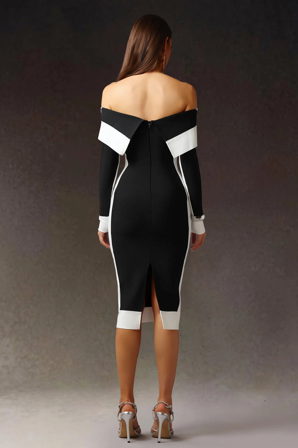 Model wearing black off shoulder color block bodycon maxi dress