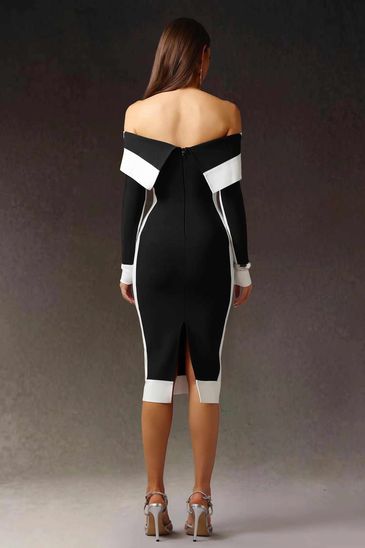 Model wearing black off shoulder color block bodycon maxi dress