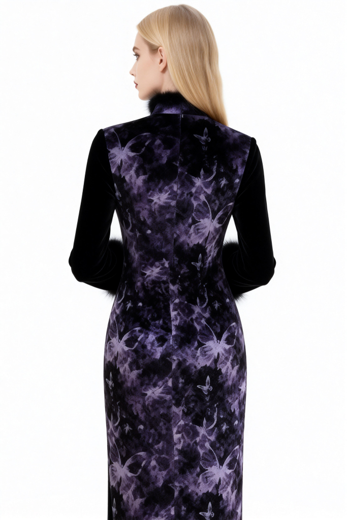 Woman wearing a black dress with a purple floral pattern on a white background
