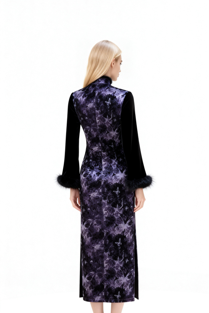 Woman wearing a long, dark purple dress with a high collar on a white background