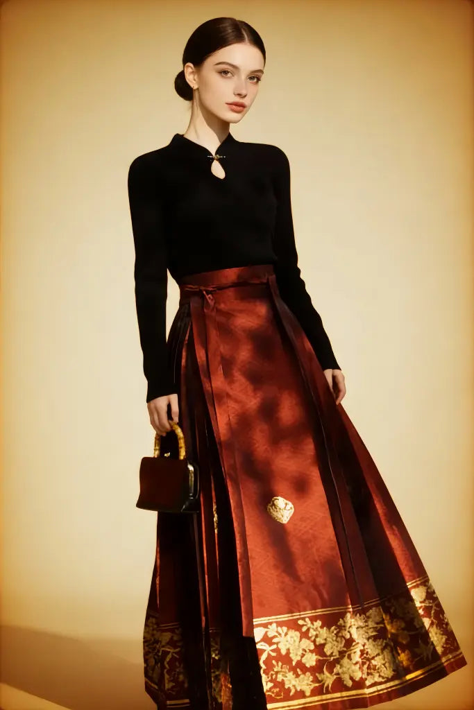 Woman wearing a black top and red skirt with gold patterns on a beige background