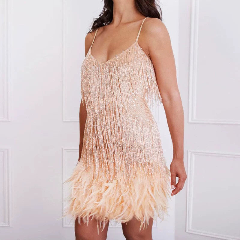 Model wearing gold fringe feather bodycon mini dress