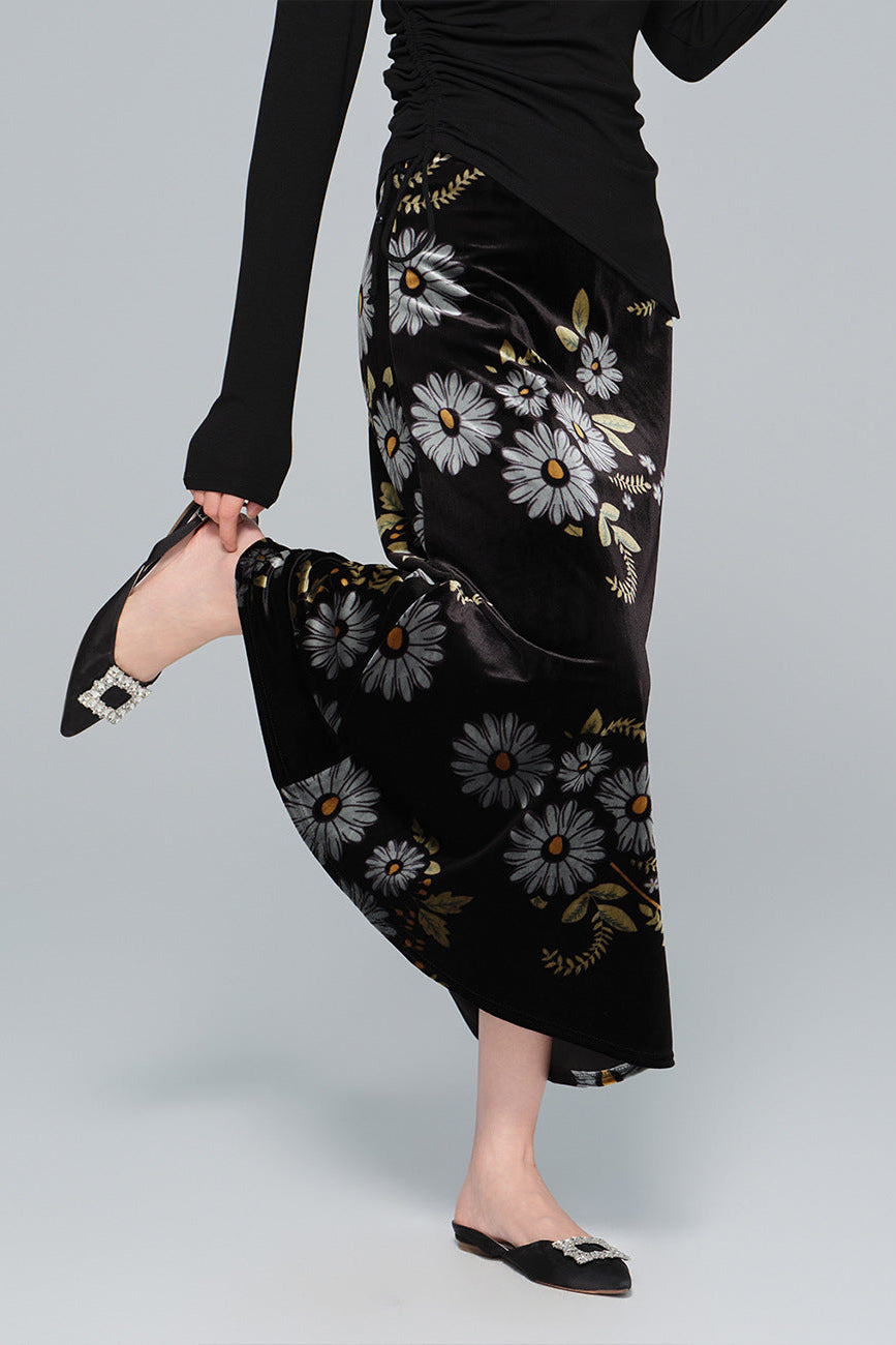 Black floral skirt worn by a woman