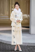 Woman in a Traditional Chinese Bamboo Embroidered Coat & Skirt Set - white, holding a handbag, standing outdoors.